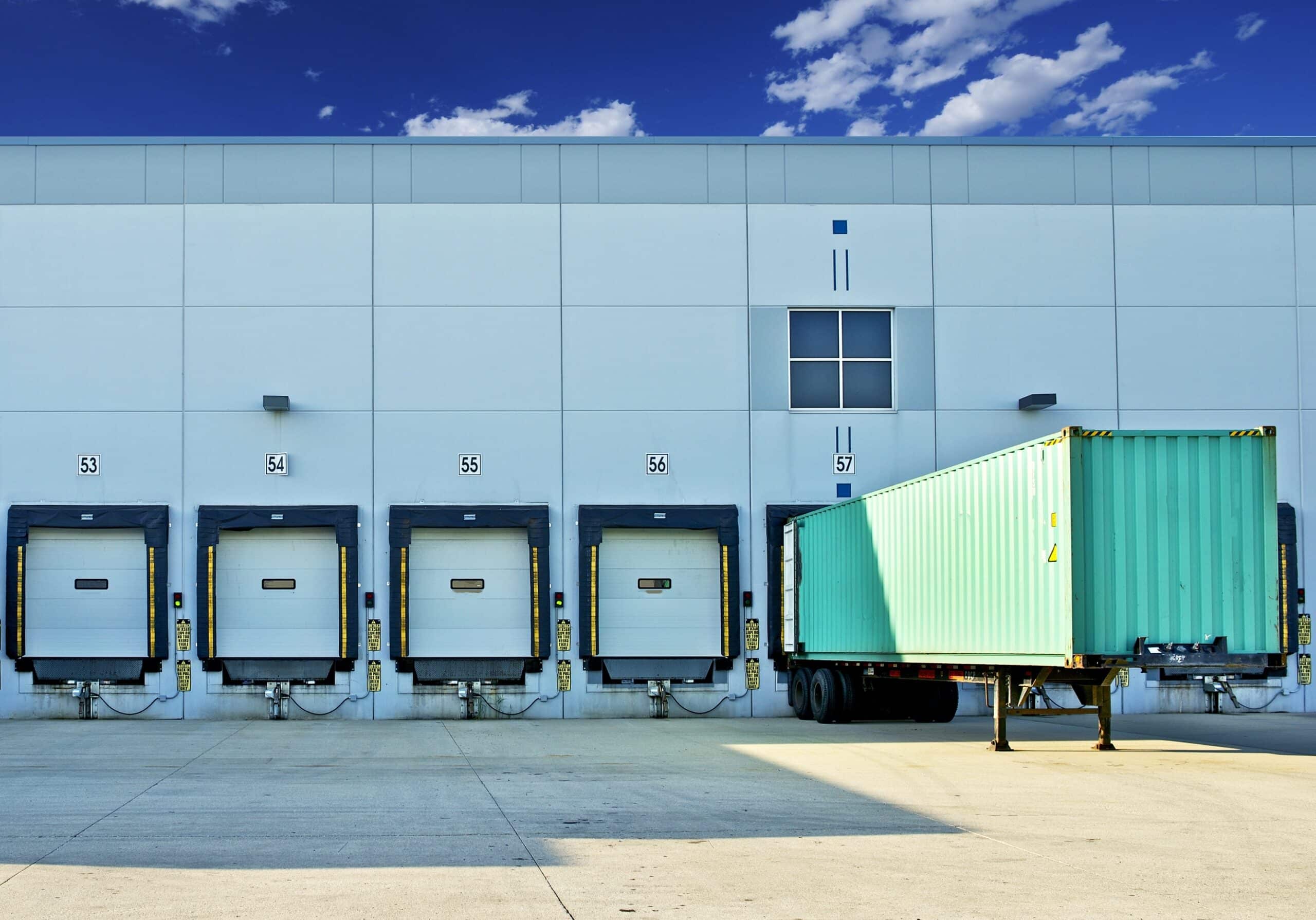Shipping container at an IWS warehouse dock door